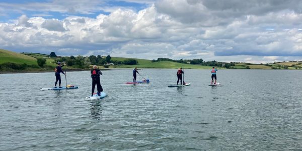 5 Paddleboarders Green Hills Backdrop