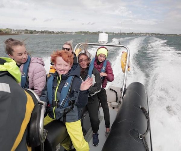 Children Smiling On Fast Rib Boat