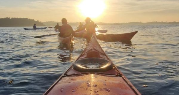 Kayak Bow View Paddling Toward Sunset