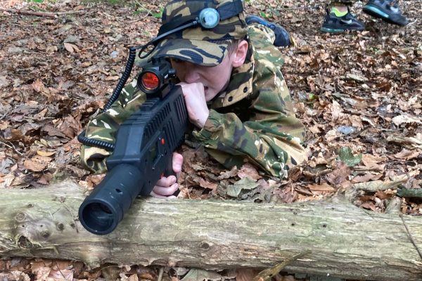 Laser Tag Crouching Behind Log