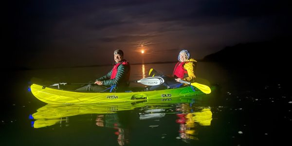 Tandem Kayakers Smiling With Full Moon